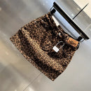 New short skirt 2025 summer American fashion elastic coffee leopard print denim hip skirt hot girl patch small short skirt