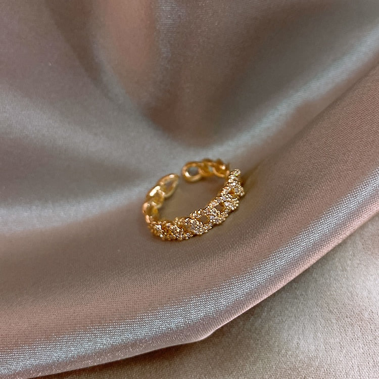 Joyería de moda coreana, anillo torcido hueco de circón con incrustaciones de cobre exquisito, anillo ajustable elegante con apertura para fiesta de boda para mujer