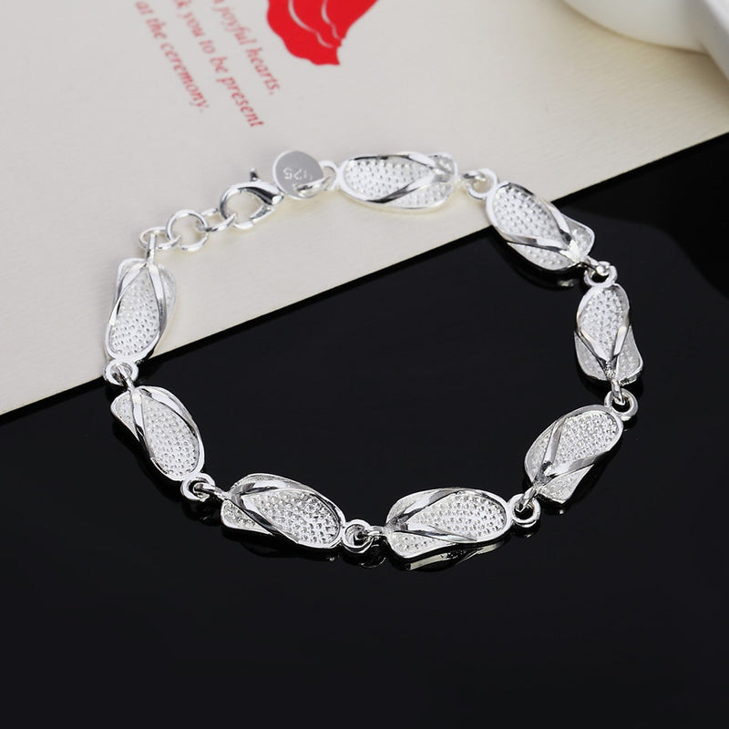 Venta caliente pulsera de color plata hermosas flores para mujer joyería de moda clásica de alta calidad al por mayor JSH-lh013