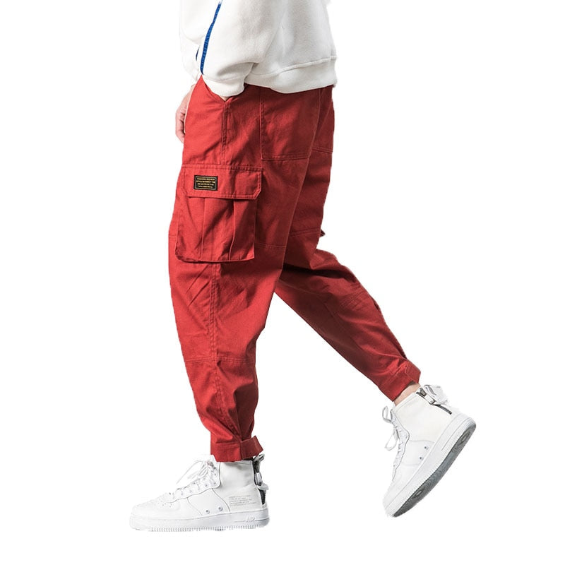 2022 Hombres Multi-bolsillo Cintura elástica Diseño Harem Pant Street Punk Hip Hop Rojo Pantalones casuales Joggers Hombre Ejército Cargo Pantalones 5XL