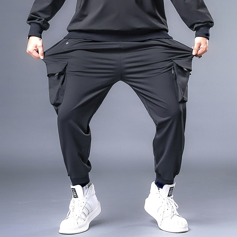 Pantalones holgados para hombre, ropa informal estilo Hip Hop, pantalones Cargo de talla grande 7XL, pantalones de chándal para hombre, pantalones de moda de gran tamaño para correr, pantalones de talla grande HX530