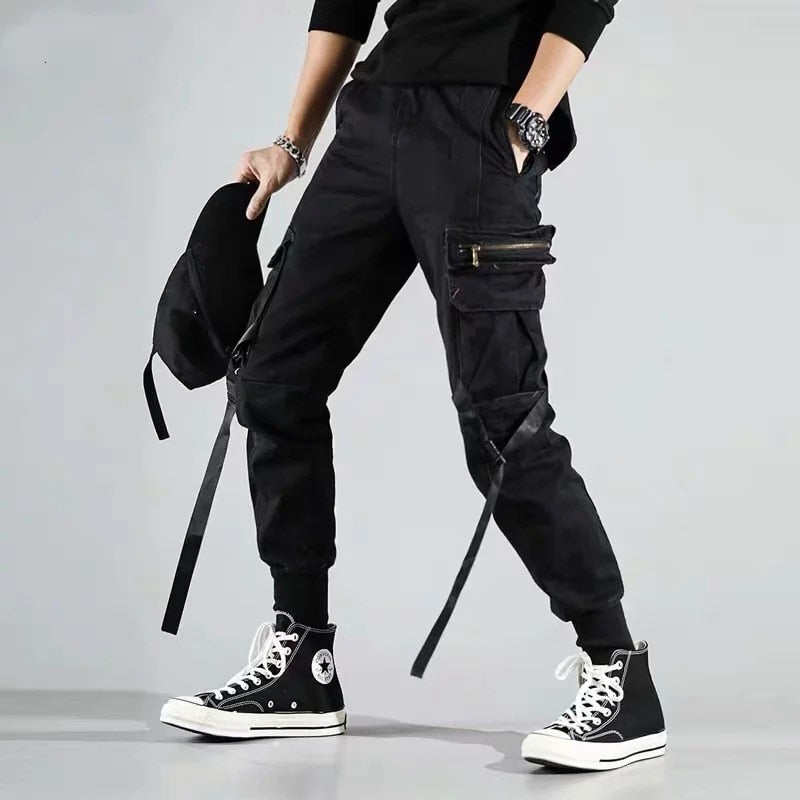 Pantalones bombachos con bolsillos laterales para hombre, otoño 2022, diseño de cintas informales de Hip Hop, pantalones para correr para hombre, ropa de calle de moda, pantalón negro