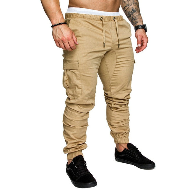 Otoño hombres pantalones Hip Hop Harem Joggers pantalones 2020 nuevos pantalones masculinos hombres Joggers sólido multibolsillo pantalones de chándal M-4XL